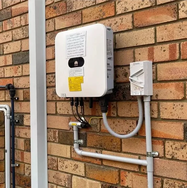 Installed Huawei solar inverter mounted on an exterior wall